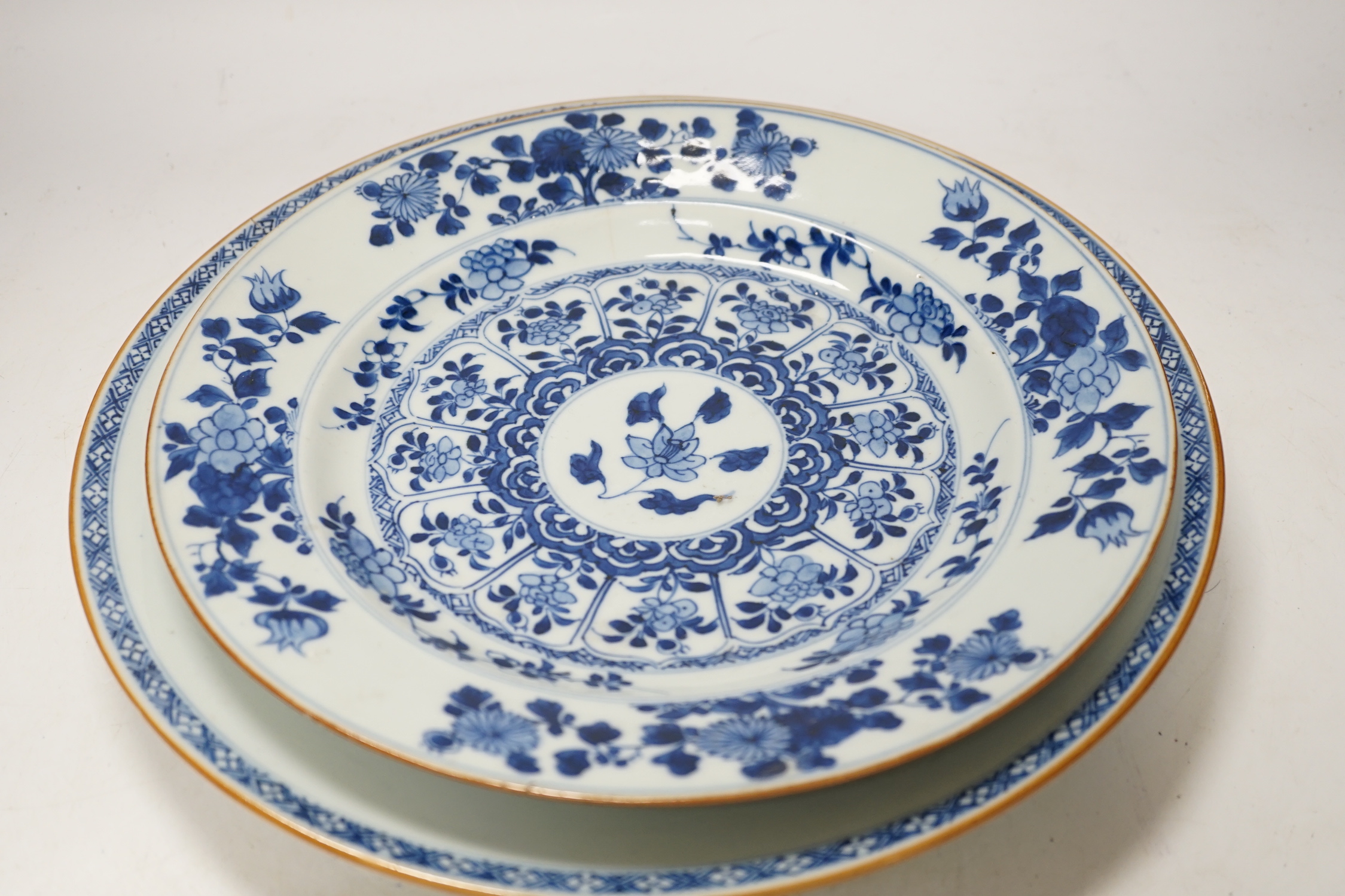 Three Chinese blue and white dishes or plates, Kangxi to Qianlong period and two later covers, largest plate 32cm diameter
